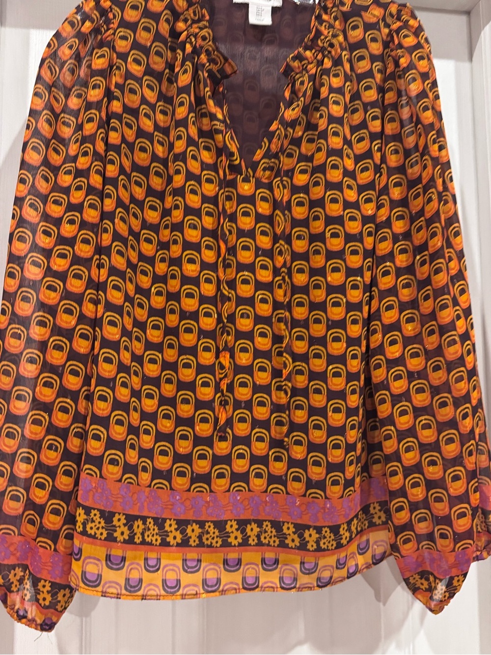 cupcakes & cashmere Orange and Black Geometric Peasant Blouse with Purple Trim
